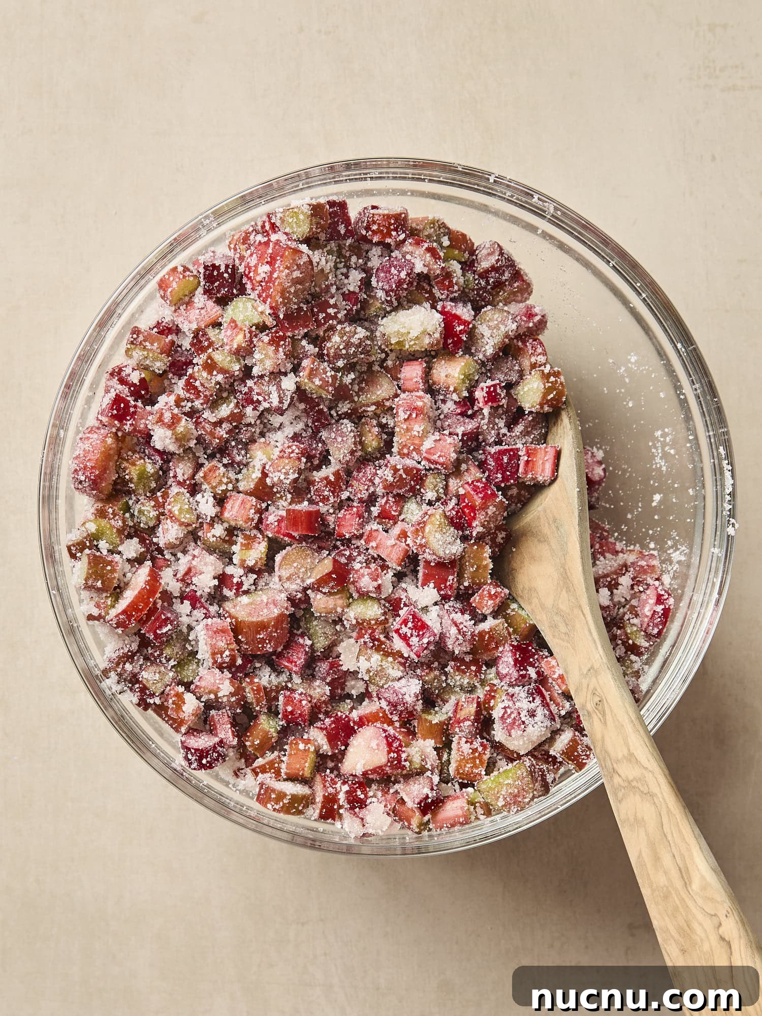 Glass bowl with rhubarb pie filling.