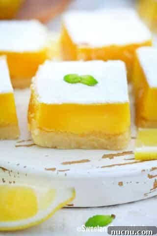 lemon squares on q white cutting board