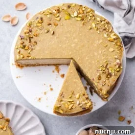 Over 10 Festive Christmas Dessert Recipes for Holiday Gatherings 3 Cheesecake on a plate with a slice cut off.
