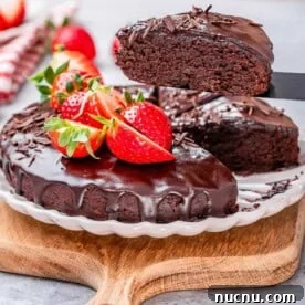 Over 10 Festive Christmas Dessert Recipes for Holiday Gatherings 7 Chocolate cake with melted chocolate and strawberries.
