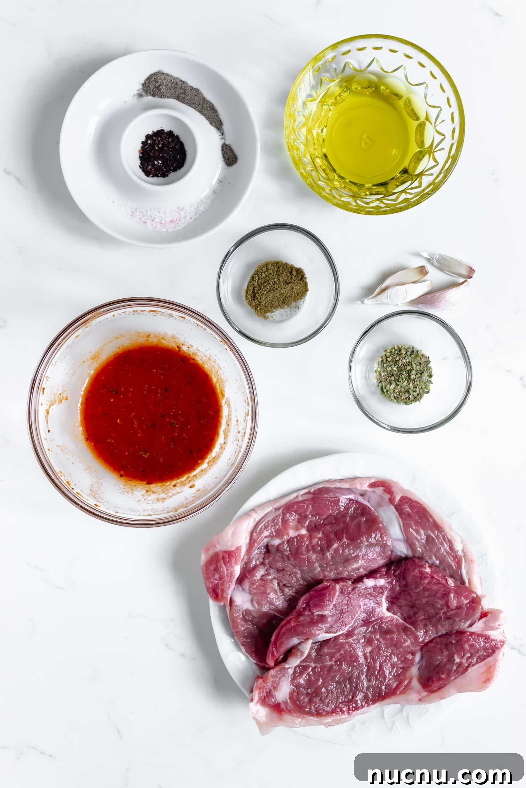 an overhead image showing the measured ingredients needed to make a batch of homemade chipotle steak strips