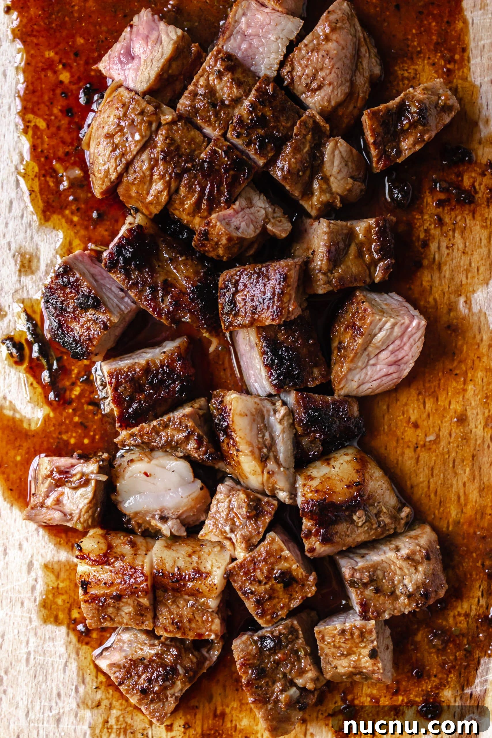 homemade chipotle steak strips chopped on a white cutting board