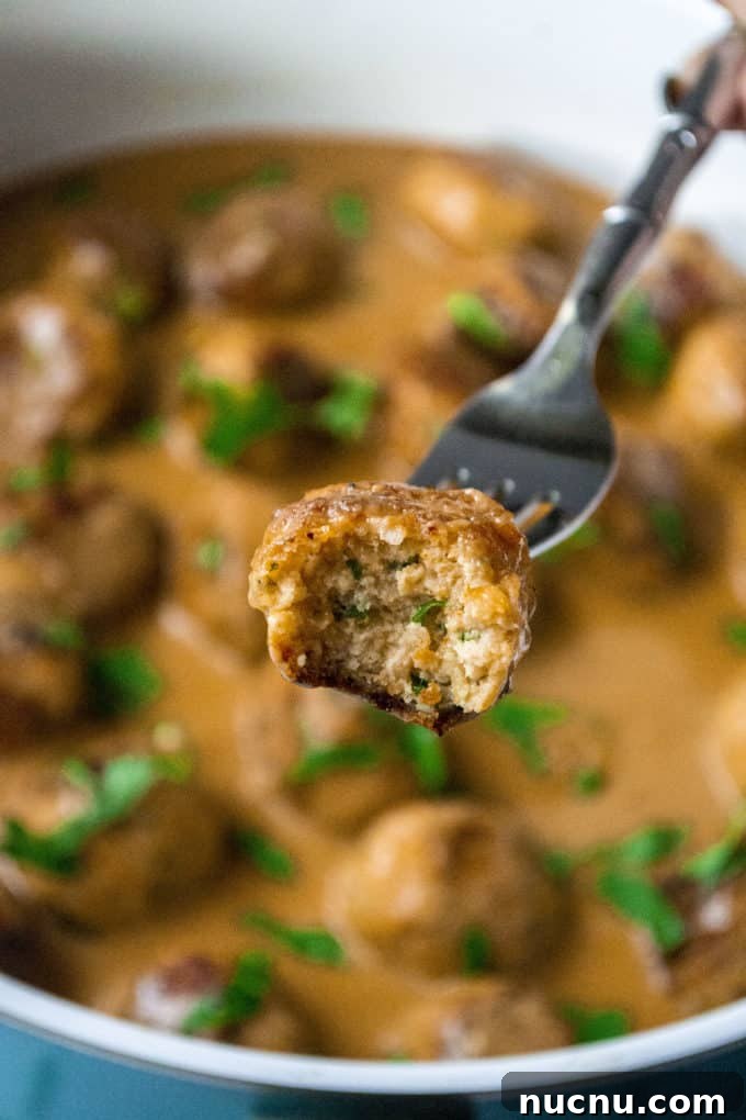 Authentic Swedish Chicken Meatballs Recipe with Creamy Sauce 4 swedish meatball with a bite taken out