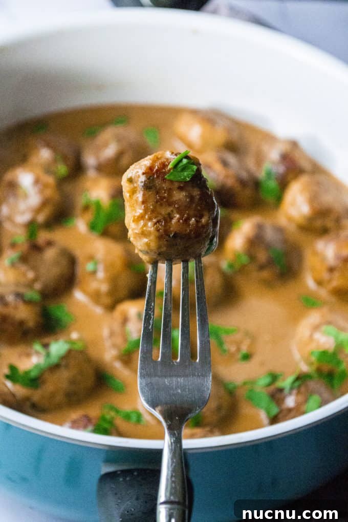 Authentic Swedish Chicken Meatballs Recipe with Creamy Sauce 5 chicken meatball on a fork