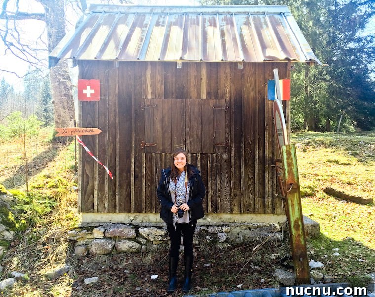 Anne Elder, standing right at the border between France and Switzerland.