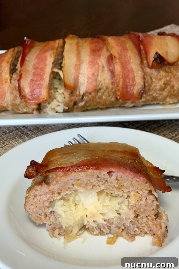 Slice of sauerkraut rolled up in ground pork wrapped in bacon