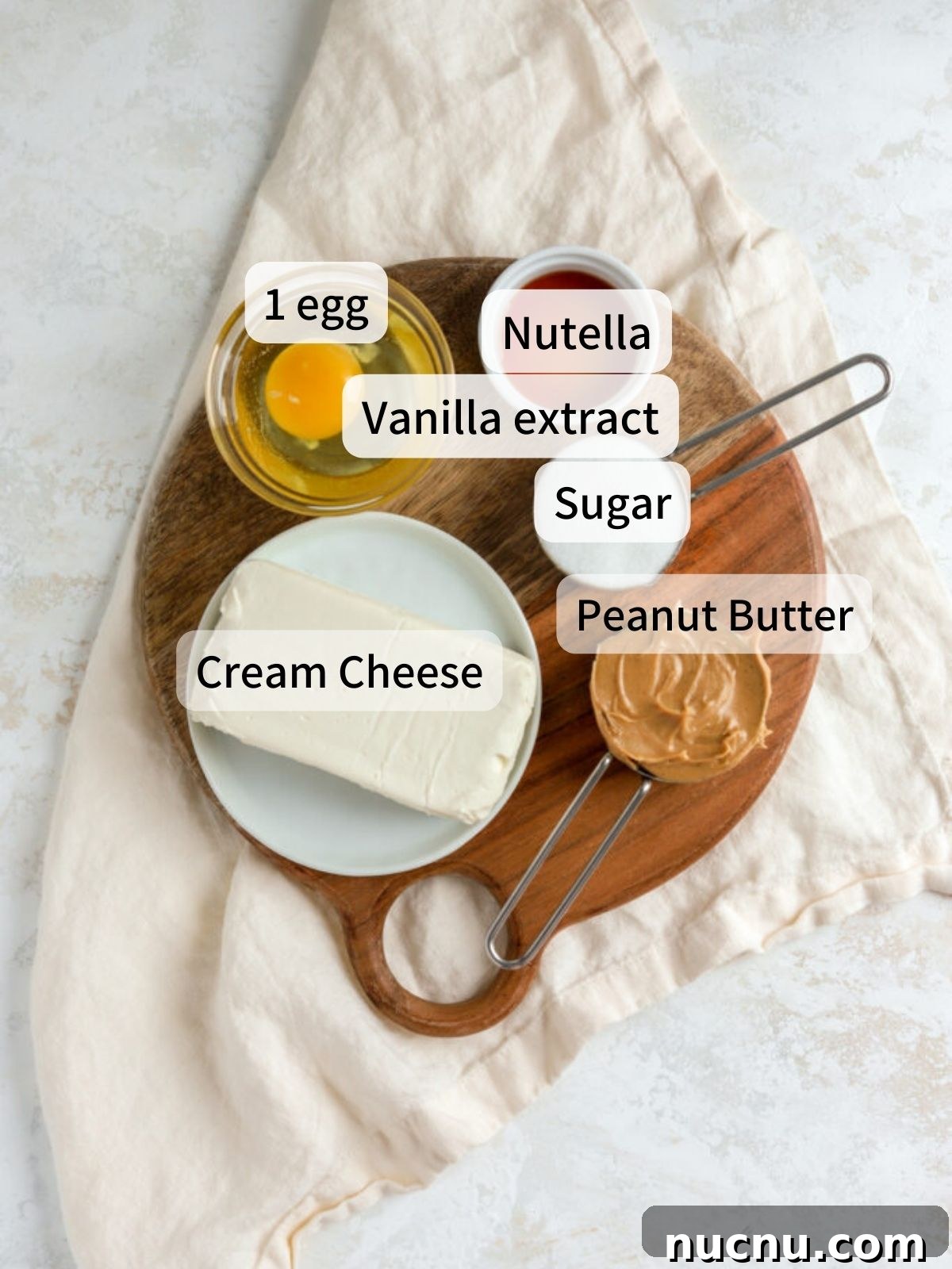 Labeled ingredients needed to make the cheesecake and Nutella layers of Nutter Butter Bars. 