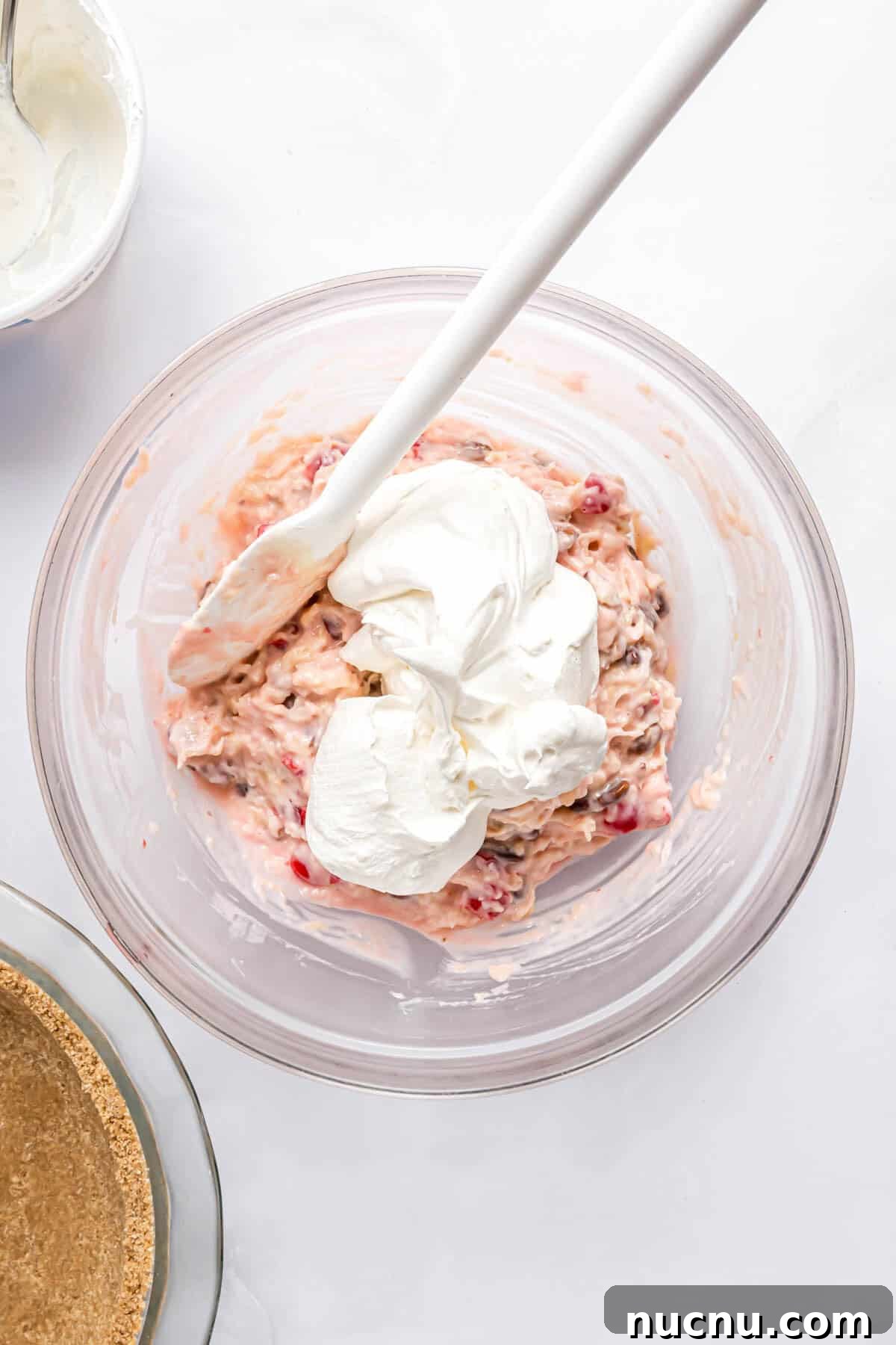 Whipped cream added to filling and not yet mixed in.