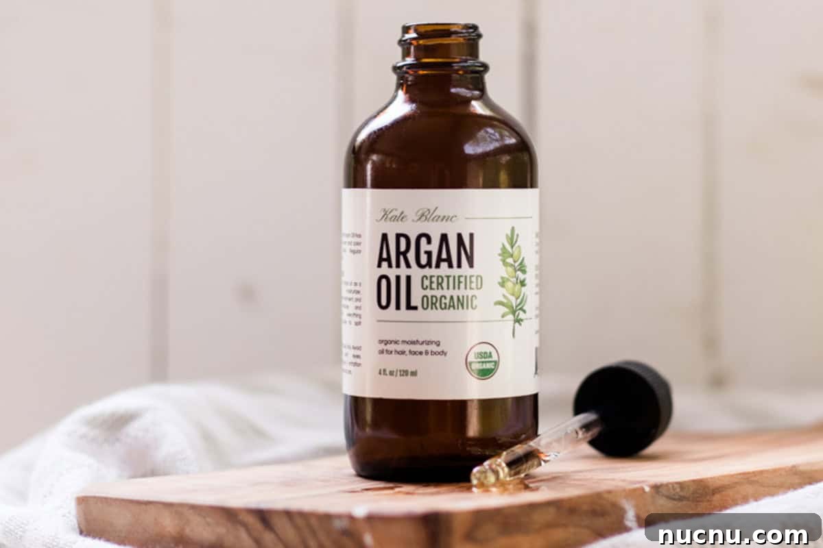 Make Your Own Argan Oil Face Serum: Hair and Skin Benefits 4 Bottle of Morrocan argan oil with a dropper top.