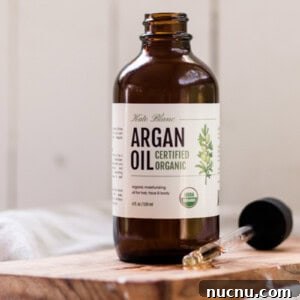 Make Your Own Argan Oil Face Serum: Hair and Skin Benefits 6 Bottle of Morrocan argan oil with a dropper top.