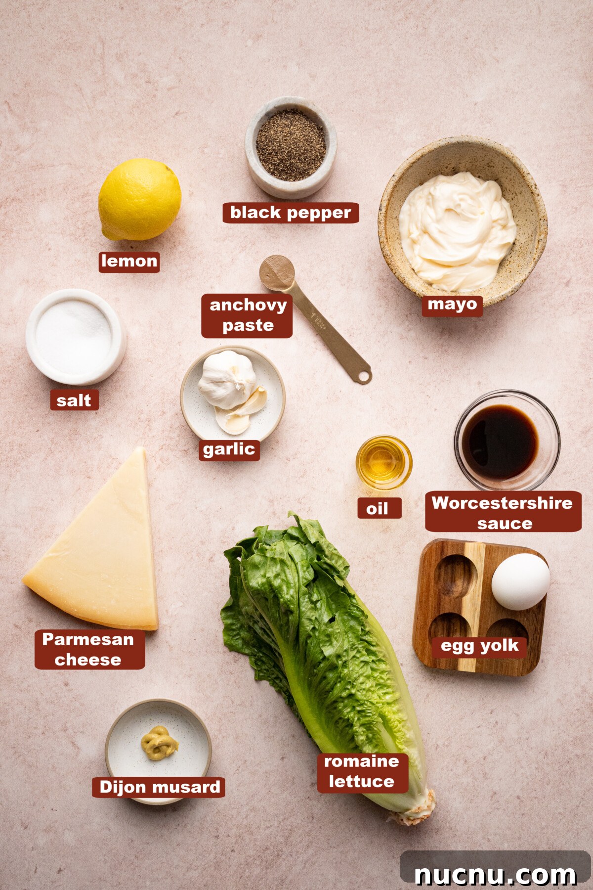 Classic Caesar Salad with Creamy Homemade Dressing and Croutons 2 All of the ingredients for caesar salad in bowls on a countertop.