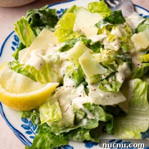 Classic Caesar Salad with Creamy Homemade Dressing and Croutons 7 Classic caesar salad on a plate for serving.