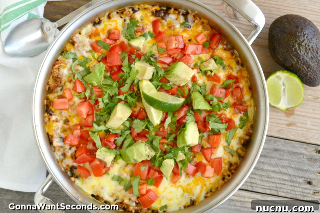 One-Pot Ground Beef Recipes for Quick Weeknight Dinners 4 One Pot Burrito Bowl topped with chopped avocados and tomatoes in a pot