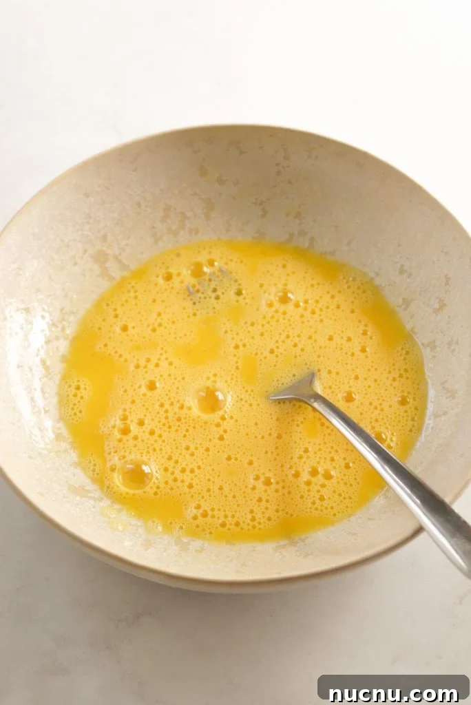 egg wash in a shallow bowl