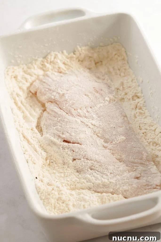 chicken breast coated in flour mixture