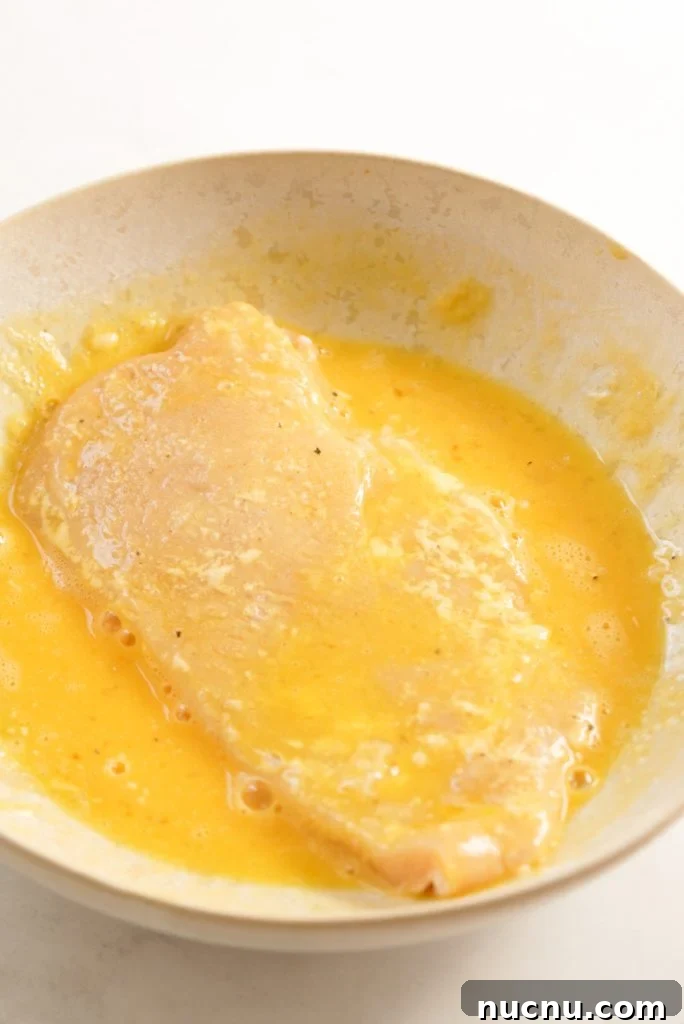 chicken breasted coated in egg wash