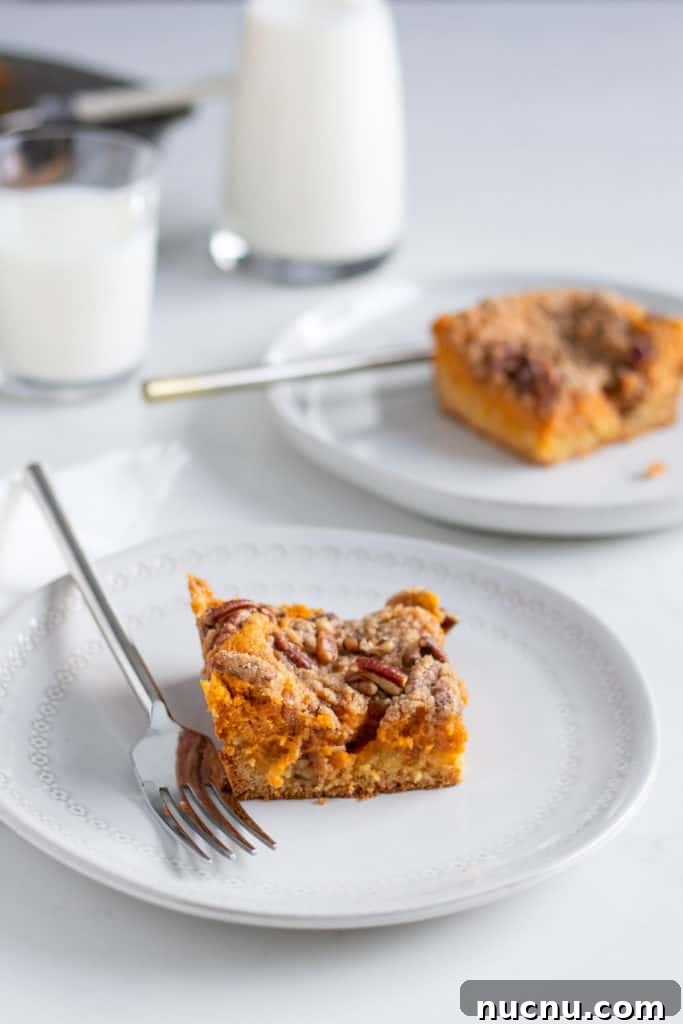 Pumpkin Gooey Butter Cake with Pecan Streusel Recipe 4 gooey butter cake slices on plates with forks