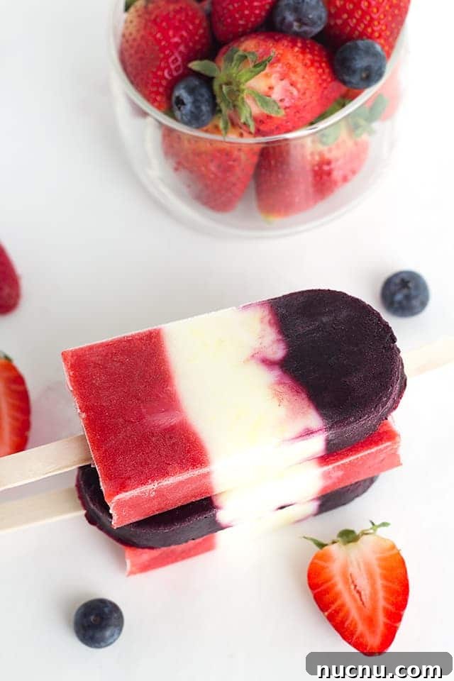 Red White and Blue Berry Yogurt Pops - Yogurt Pops for the 4th of July. They're full of fresh berries and lemon yogurt!