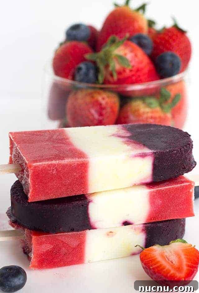 Red White and Blue Berry Yogurt Pops - Yogurt Pops for the 4th of July. They're full of fresh berries and lemon yogurt!