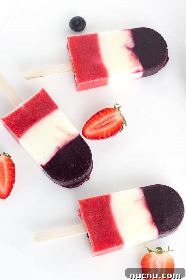 Red White and Blue Berry Yogurt Pops - Yogurt Pops for the 4th of July. They're full of fresh berries and lemon yogurt!