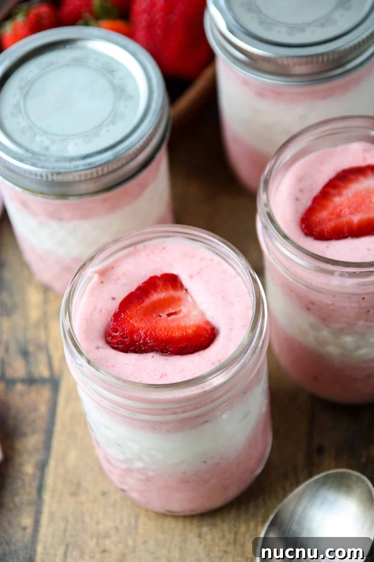 Layered Strawberry Mousse Recipe: Light & Creamy Dessert 3 A close up shot of the dessert in a jar.