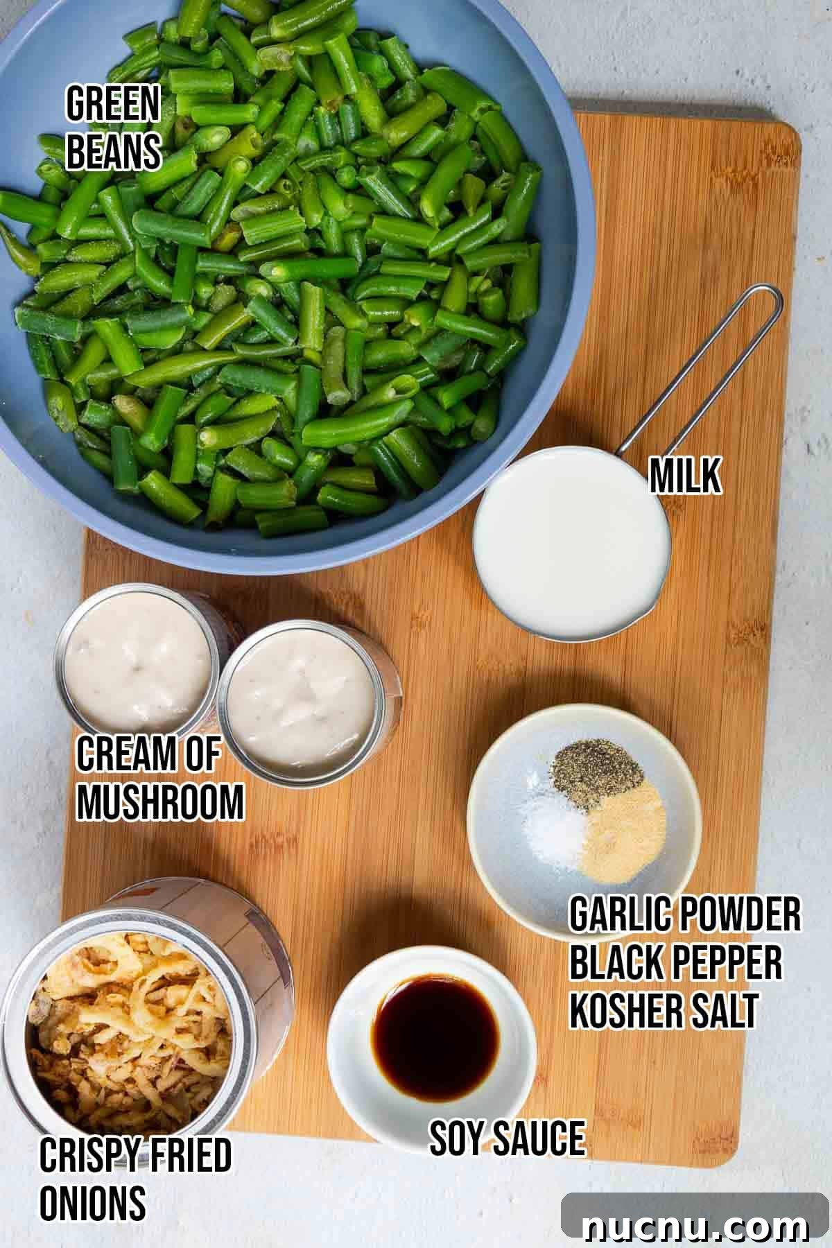 Double Green Bean Casserole Recipe for Family-Sized Meals 3 Green bean casserole ingredients: frozen green beans, crispy fried onions, cream of mushroom soup, milk, soy sauce, garlic powder, black pepper, and kosher salt.