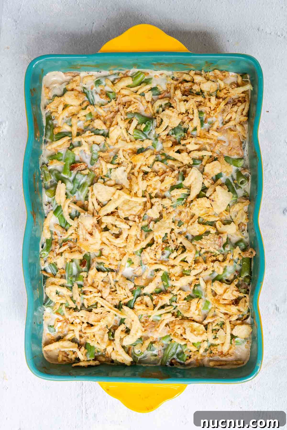 Double Green Bean Casserole Recipe for Family-Sized Meals 6 The green bean mixture is topped with an even layer of crispy fried onions.