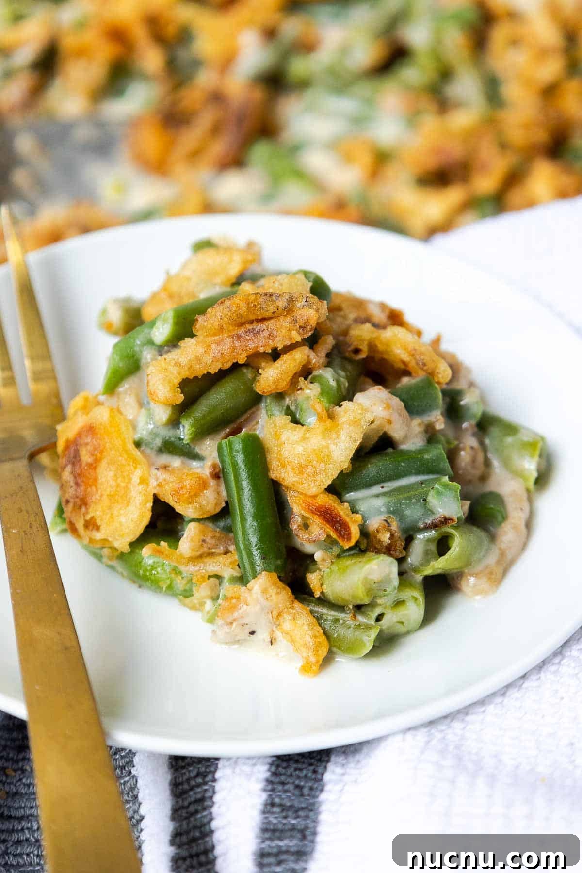 Double Green Bean Casserole Recipe for Family-Sized Meals 8 Green bean casserole served on a small plate.