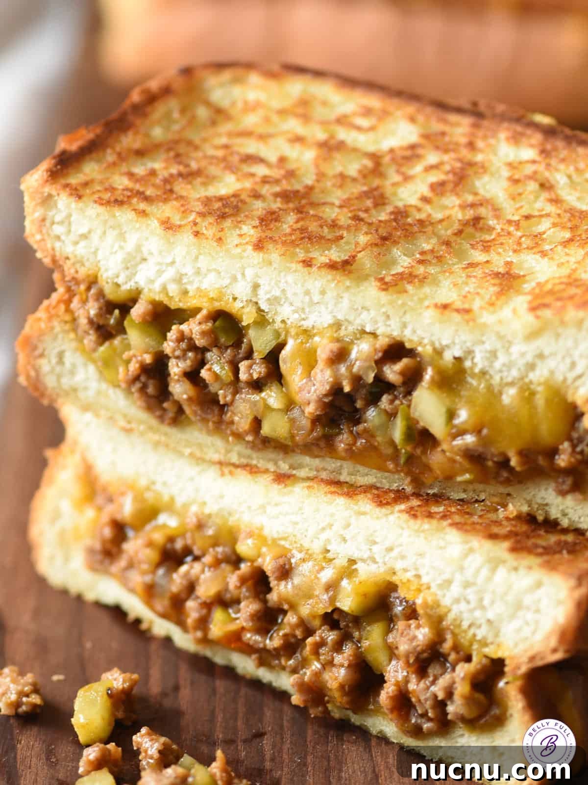 sloppy joe grilled cheese cut in half stacked