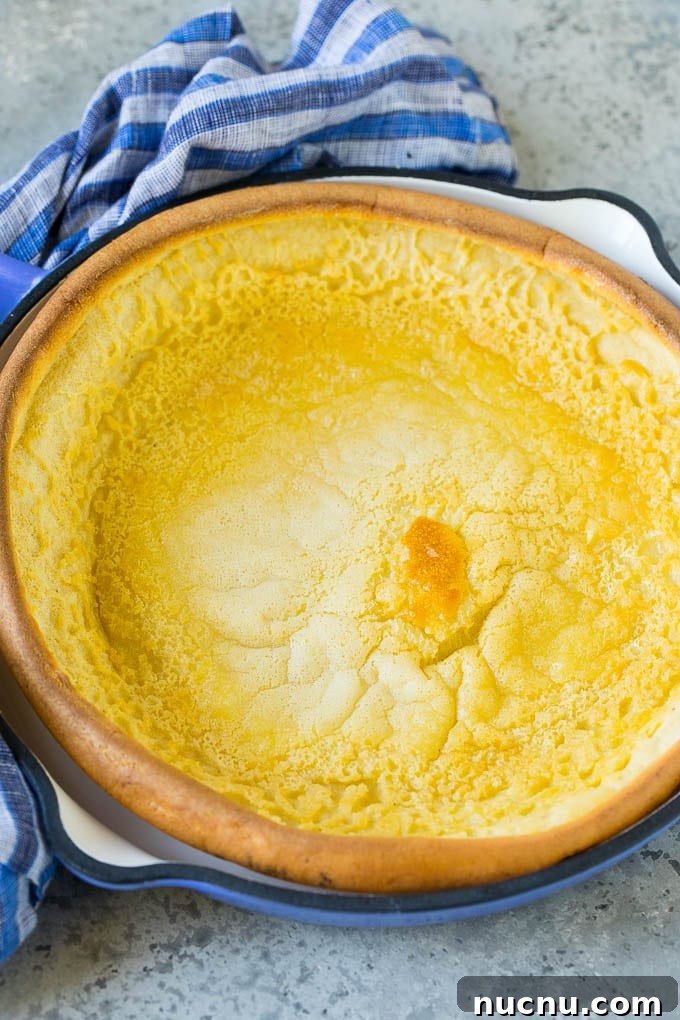 Skillet Dutch Baby A puffed pancake in a skillet.