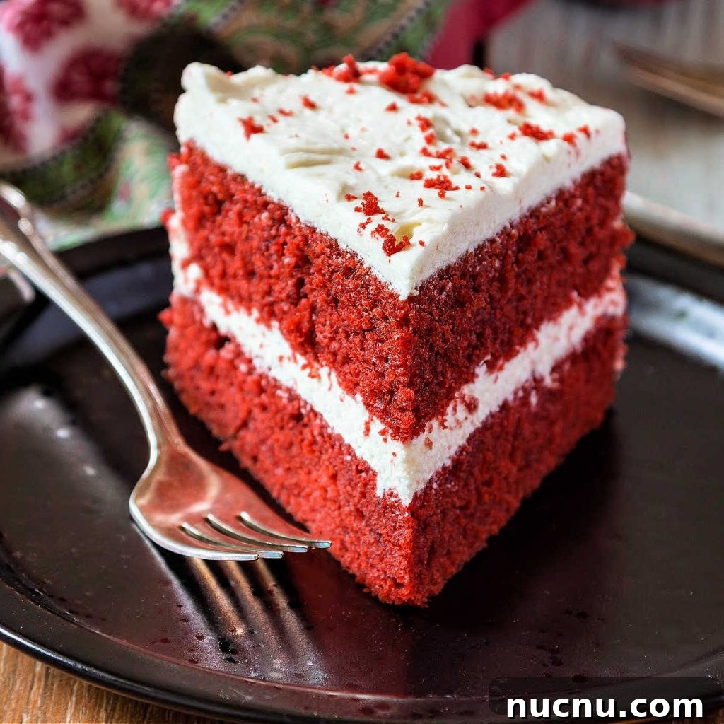 Red Velvet Cake with Silky Ermine Buttercream Frosting 5 slice of cake with white icing on black plate