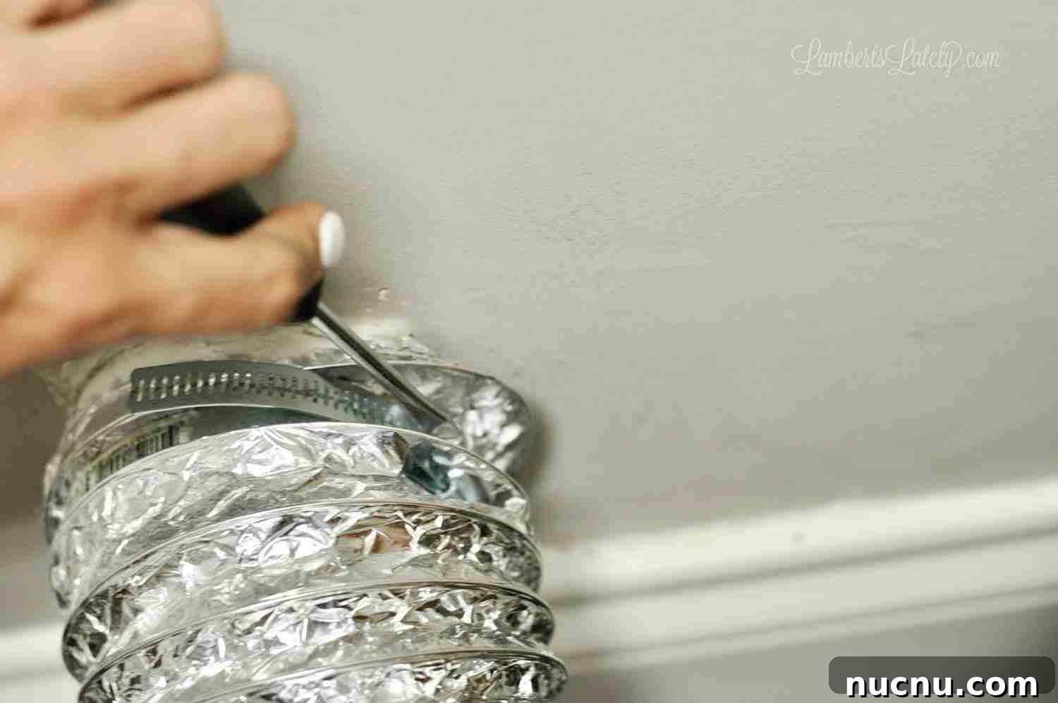 disconnecting a dryer vent hose from the wall