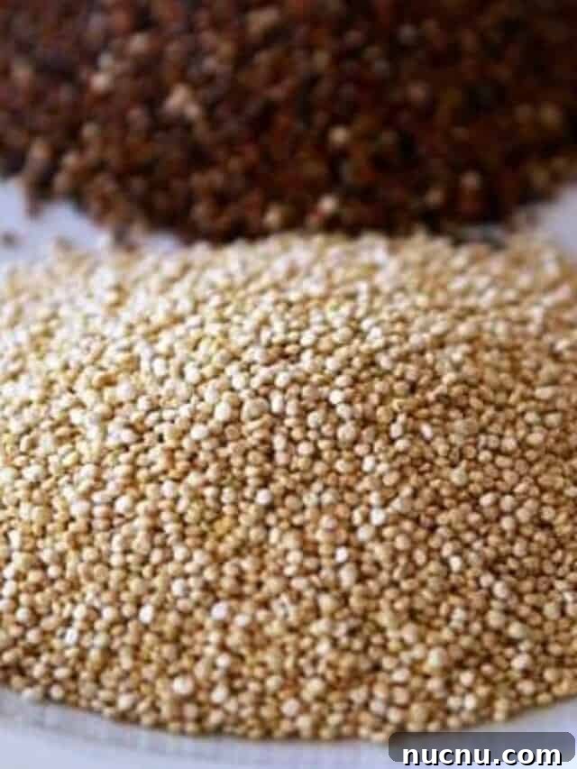 All About Quinoa - piles of gold and red raw quinoa