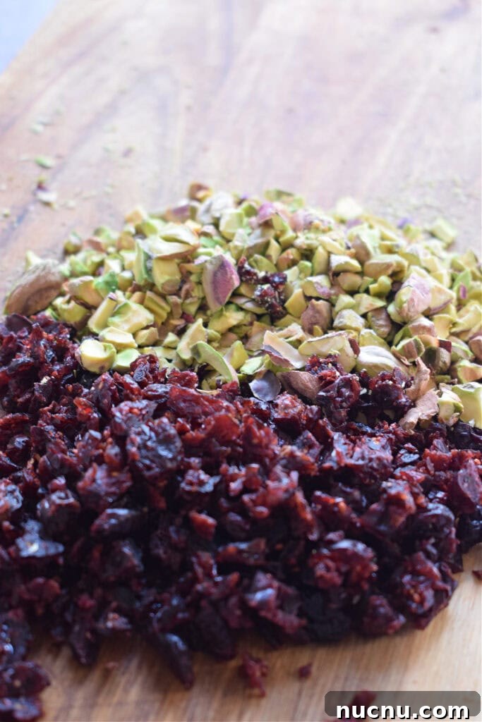 Cranberry Pistachio Goat Cheese Ball Recipe for Parties 7 Chopped cranberries and pistachios.