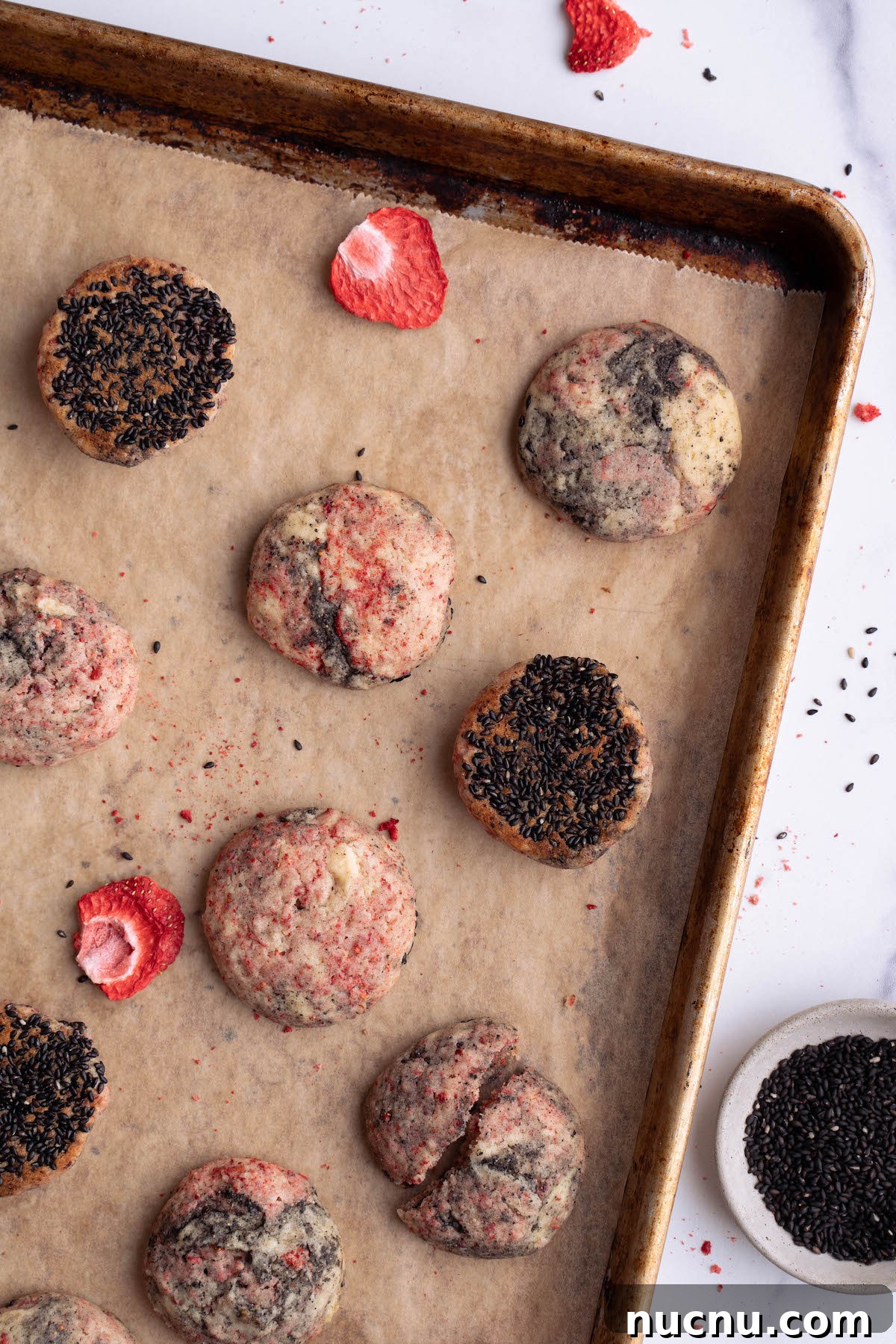 Strawberry and Black Sesame Cookies Recipe for Flavorful Cookies 2 Strawberry black sesame cookies on a baking sheet