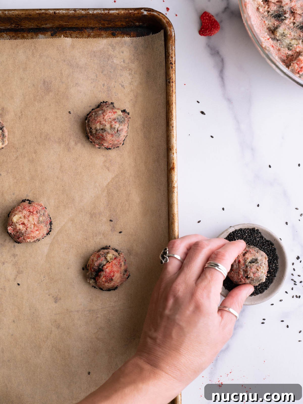 Strawberry and Black Sesame Cookies Recipe for Flavorful Cookies 8 Dipping strawberry swirl cookies into black sesame seeds