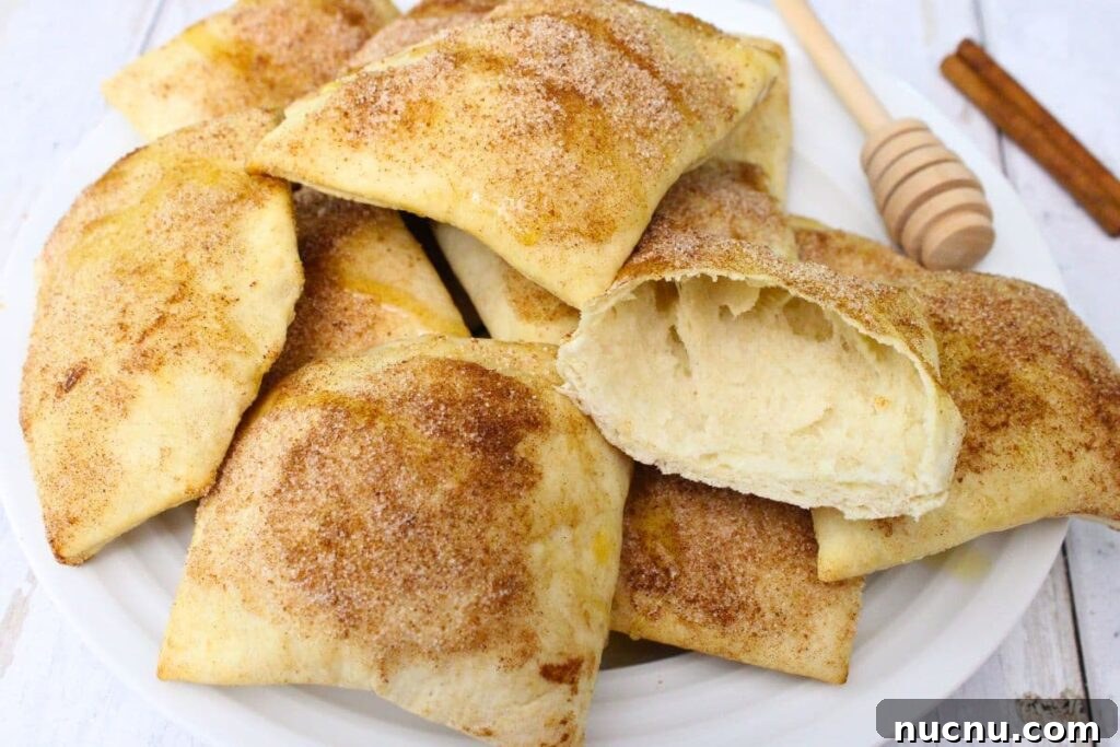 Air Fryer Sopapillas Recipe: Crispy Mexican Sweet Dessert 3 plate of air fryer sopapillas with one cut in half to show the insides