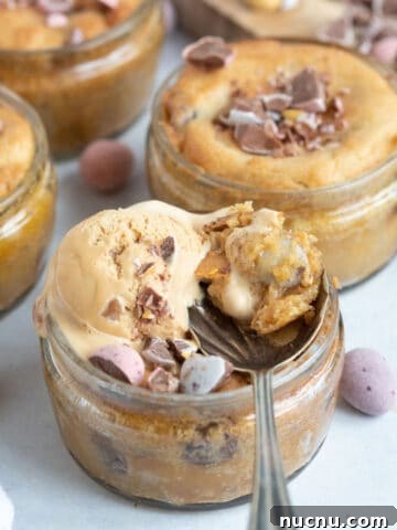 Air fryer mini egg dessert pots with a scoop of ice cream on top.