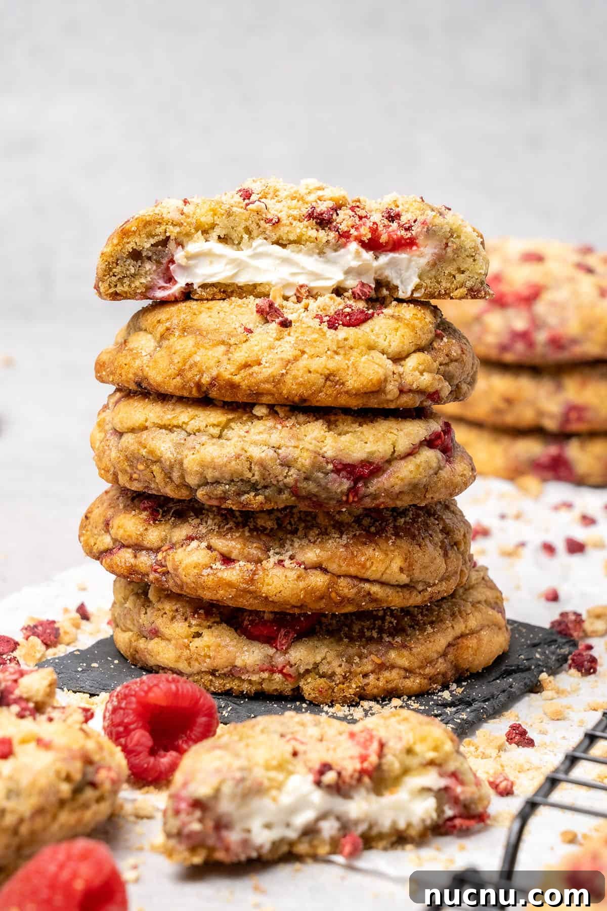 25 Unique Cookie Recipes You’ll Want to Bake Now 13 a stack of raspberry cheesecake cookies.