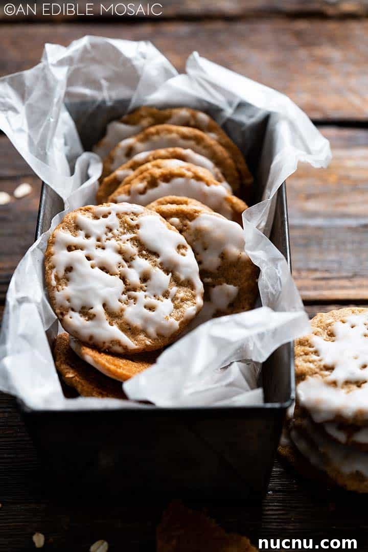 25 Unique Cookie Recipes You’ll Want to Bake Now 14 iced oatmeal cookies in a baking pan.