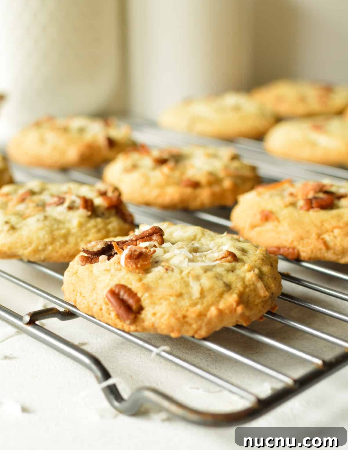 25 Unique Cookie Recipes You’ll Want to Bake Now 4 coconut pecan cookies on wire rack