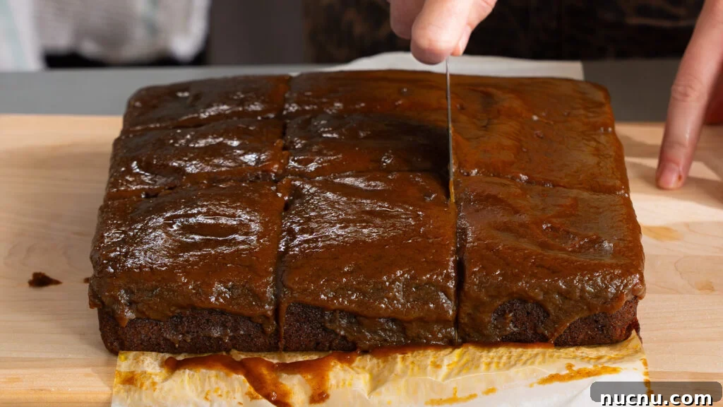 Pumpkin Sticky Toffee Pudding with Butterscotch Sauce Recipe 7 Pumpkin sticky toffee pudding cake on a cutting board.