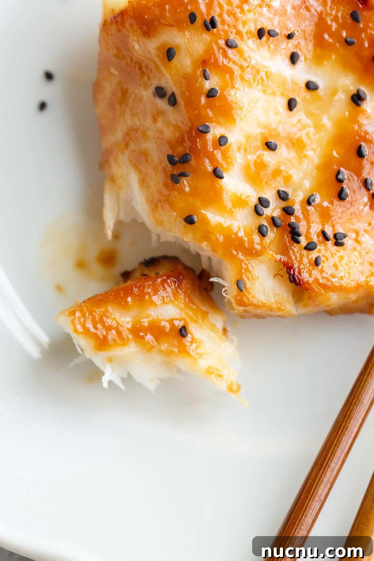 Crispy Air Fryer Miso Cod Recipe — Quick Weeknight Dinner 9 Air fryer miso cod up close with a piece flaked off