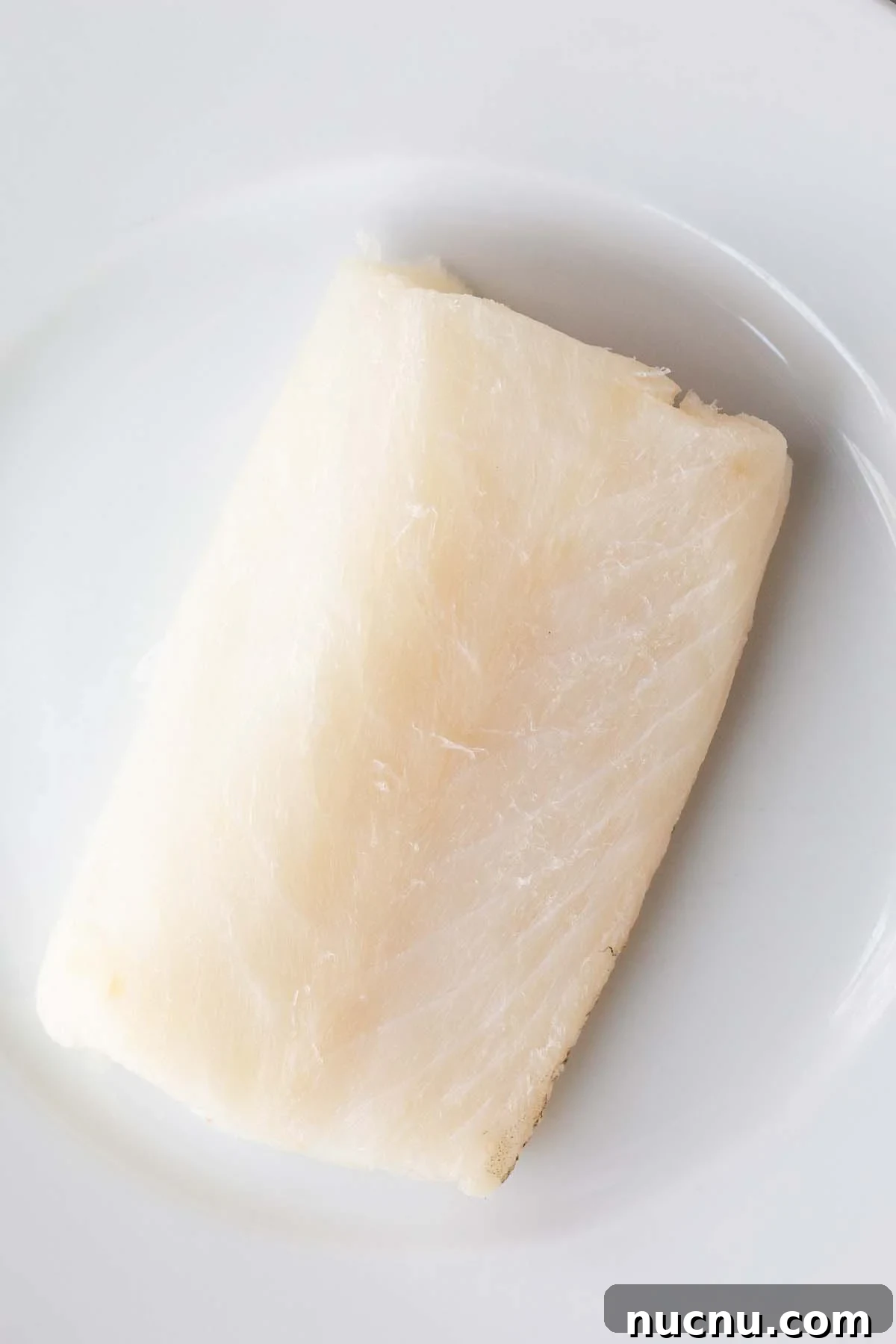 Crispy Air Fryer Miso Cod Recipe — Quick Weeknight Dinner 4 Raw cod on a white plate