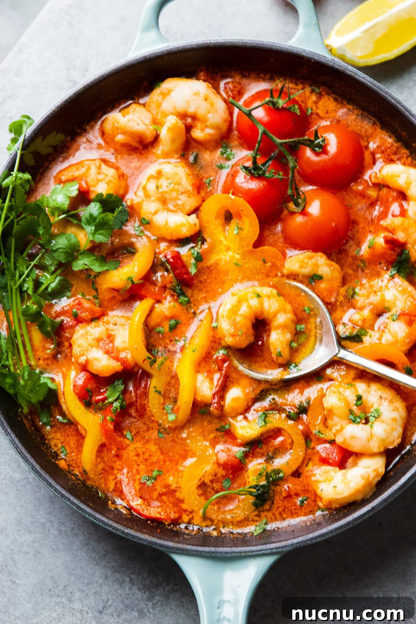 Moqueca de Camarão Shrimp Stew Recipe — Brazilian Coconut Shrimp Stew 3 Brazilian inspired shrimp stew recipe in cast iron skillet with peppers, tomatoes and cilantro in coconut broth.