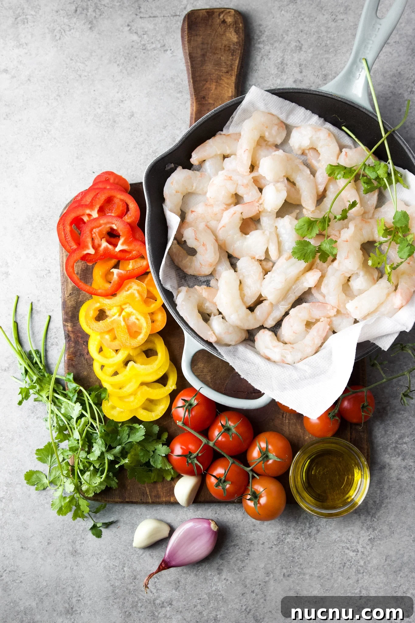Moqueca de Camarão Shrimp Stew Recipe — Brazilian Coconut Shrimp Stew 4 Ingredients for shrimp stew moqueca de camarão measured on a cutting board.
