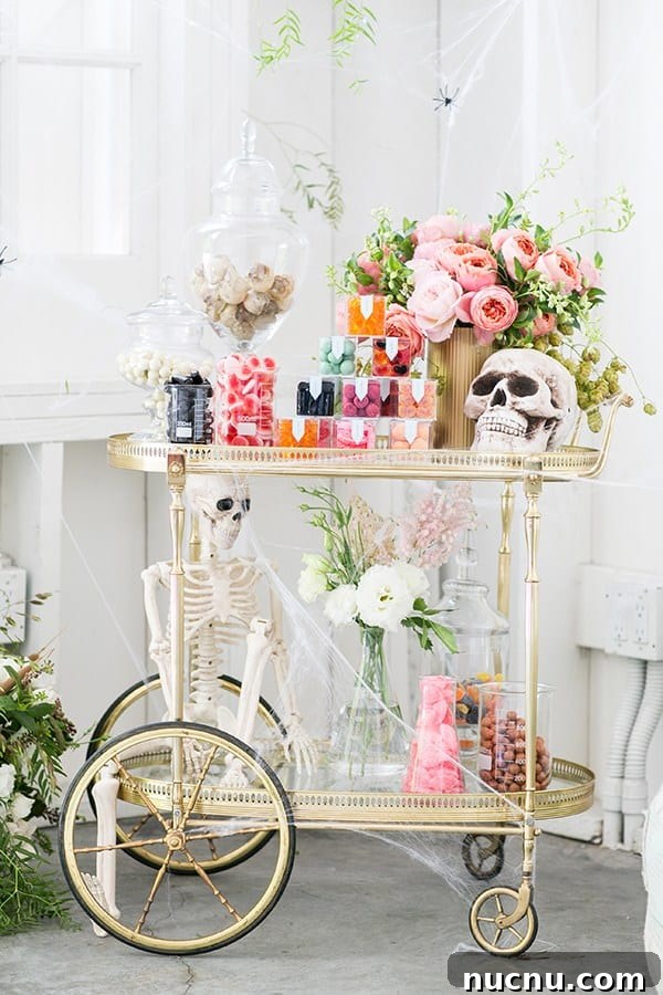 Halloween Candy Cart Ideas to Wow Trick-or-Treaters 3 candy cart for Halloween with flowers, skeletons, spider webs.
