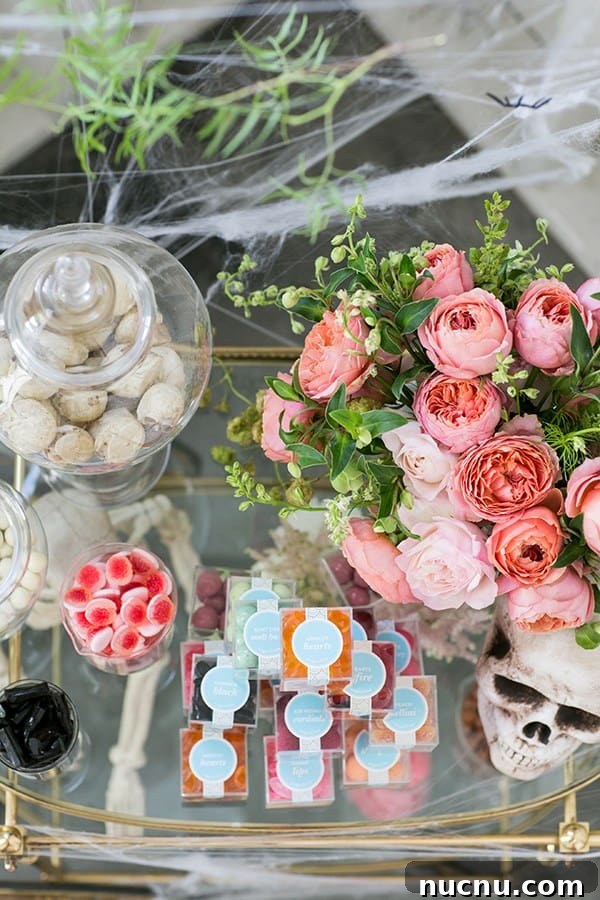 Halloween Candy Cart Ideas to Wow Trick-or-Treaters 4 Flowers, skeleton and candy on a candy cart.