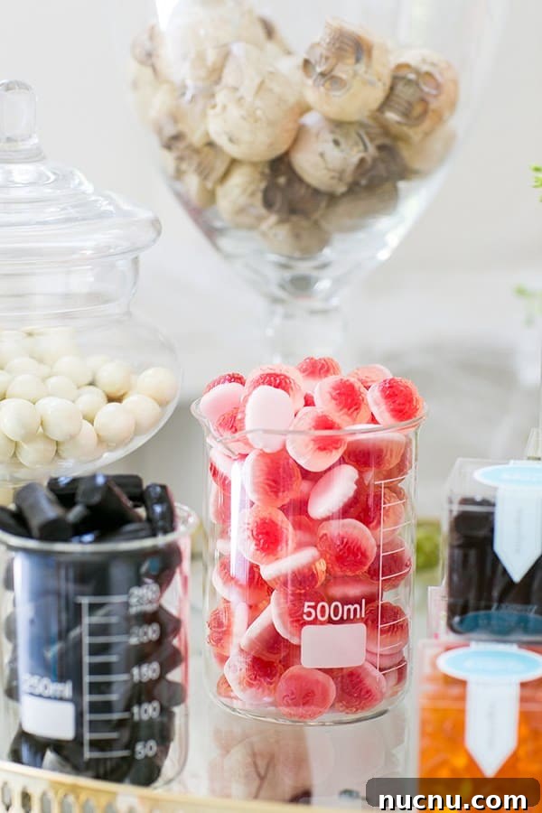 Halloween Candy Cart Ideas to Wow Trick-or-Treaters 5 Brain candy in beakers on a Halloween candy cart.