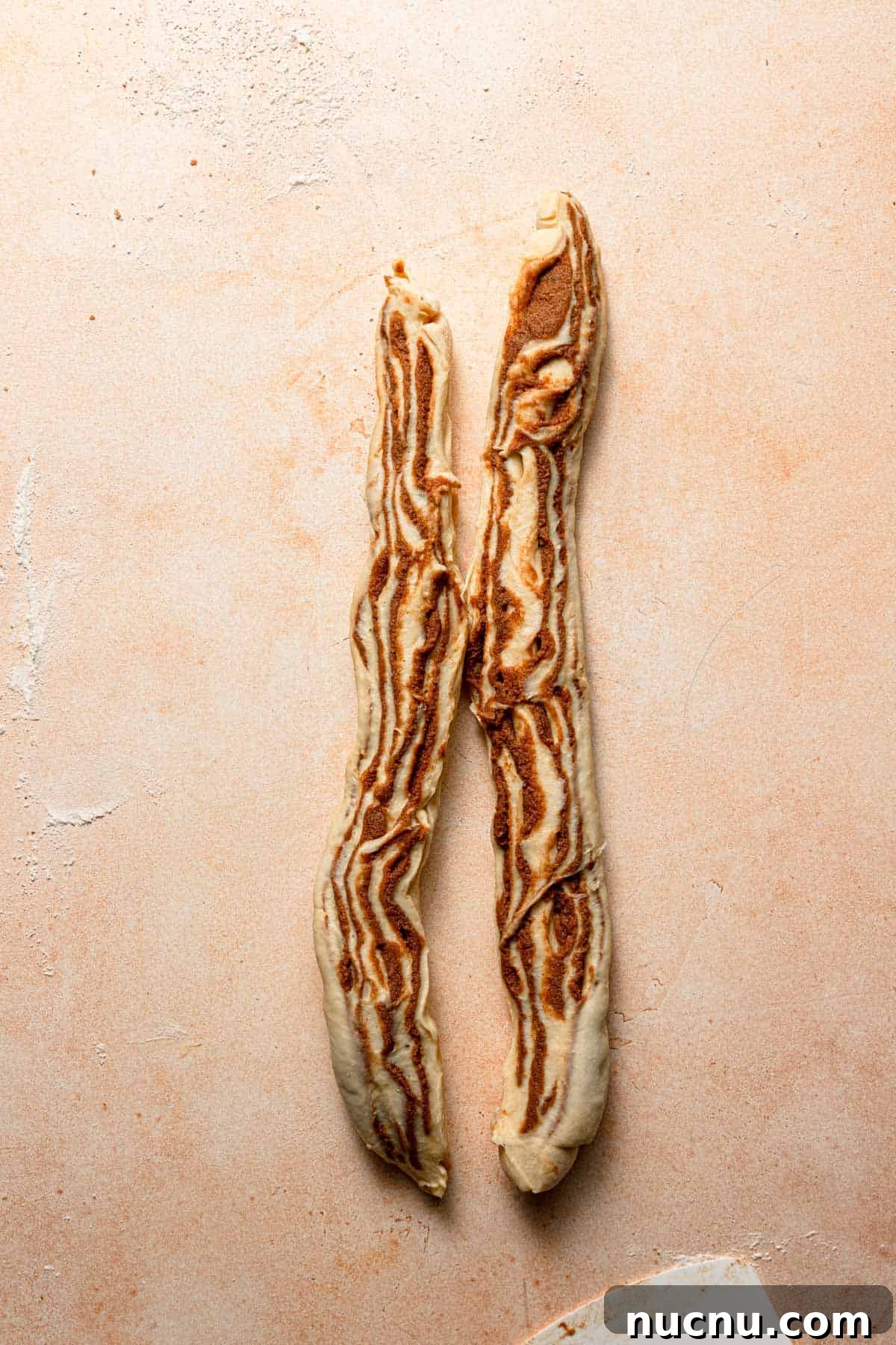 Cut the log at the center, vertically.